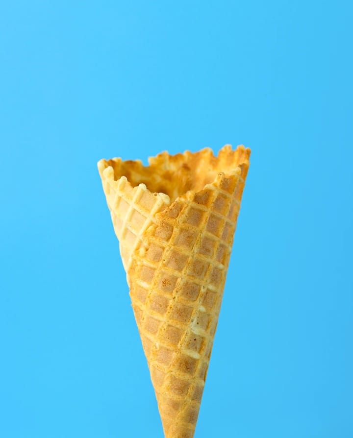 Fancy ice-cream cone with a blue background